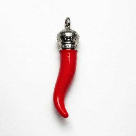 Red horn-shaped pendant with silver top on a white background