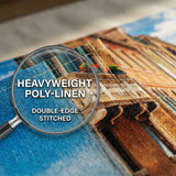 Close-up of cross-stitched fabric with a magnifying glass highlighting 'heavyweight poly-linen' and 'double-edge stitched' text.