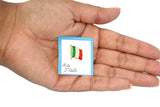 Metal lapel pin shaped like a waving Italian flag with vertical stripes in green, white, and red. Gold-colored edges and flagpole add elegance, while the 1"x5" size and secure metal clasp make it ideal for jackets, hats, or bags. A stylish symbol of Italian pride and heritage.