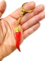 Red Horn Keychain in Gold in Hand
